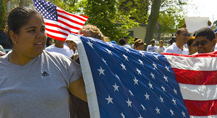 Demonstrators Holding the US Flag at a Rally